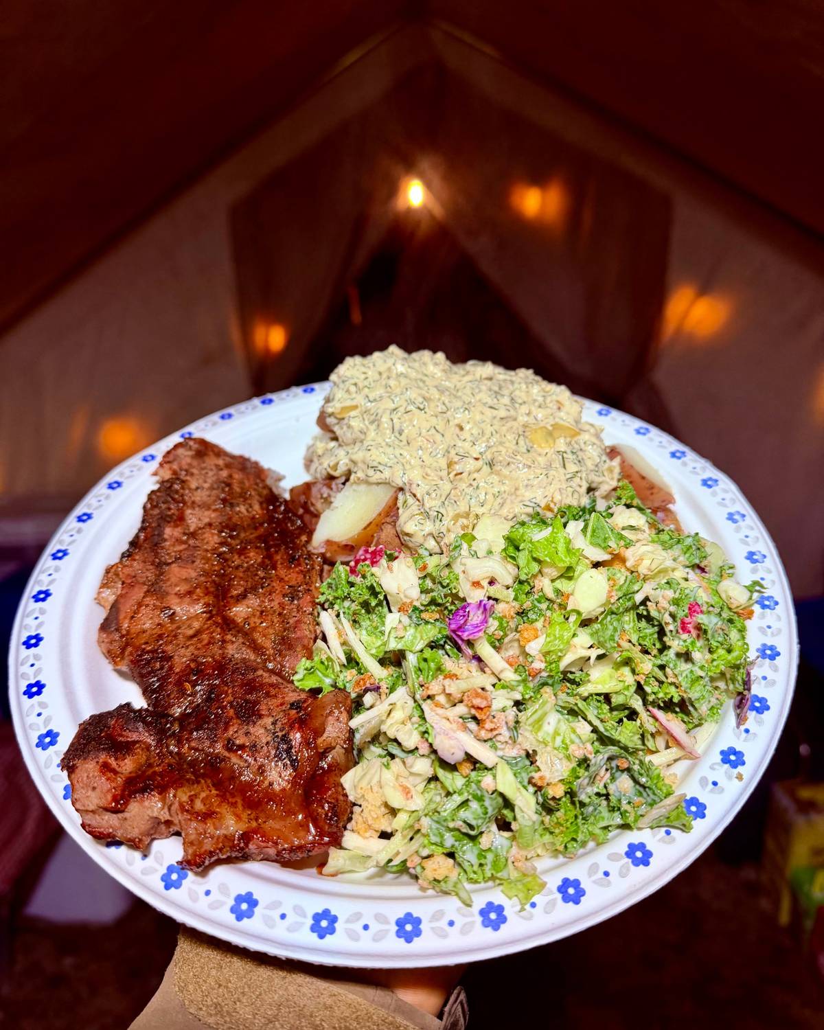 Steak dinner served in camp