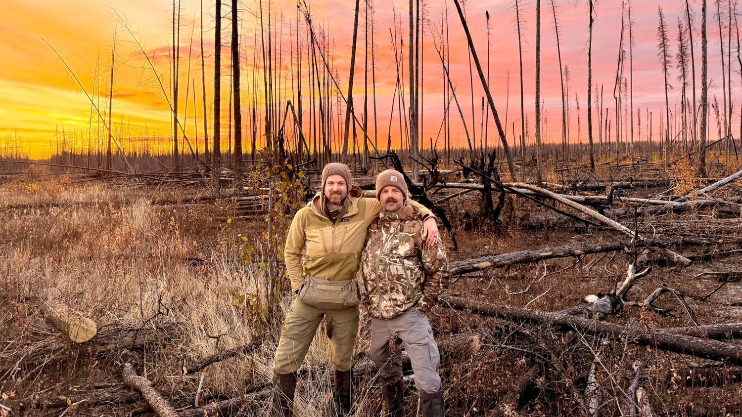 Two hunters at sunrise in Alberta’s northern backcountry
